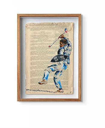 framed picture on newspaper of an African man with an assegai and shield
