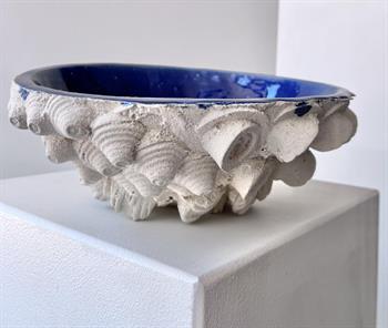 White earthenware with blue glaze sculpture inspired by a sea shell 