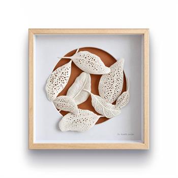 Jo Roets Leaf #5, eight textured white clay leaves arranged around a terracotta circle in a natural wood box frame.