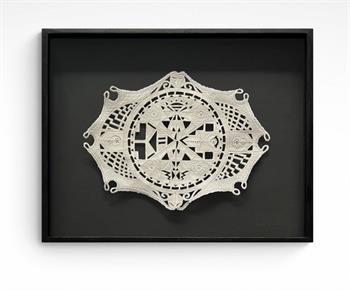 delicate clay wall sculpture inspired by tribal designs, framed behind glass