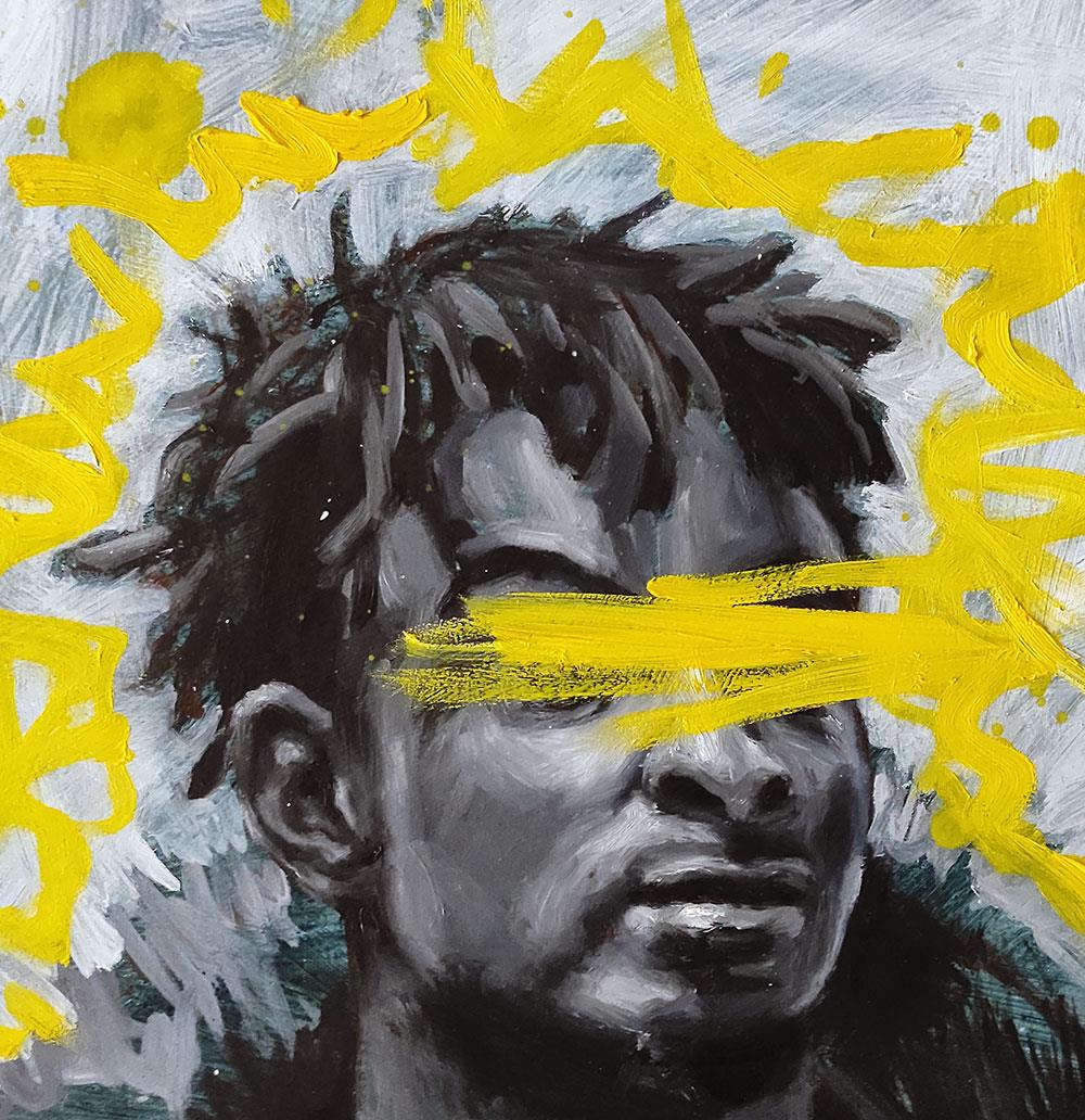 portrait of an African man with graffiti yellow paint