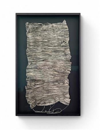 pleated paper artwork in black frame