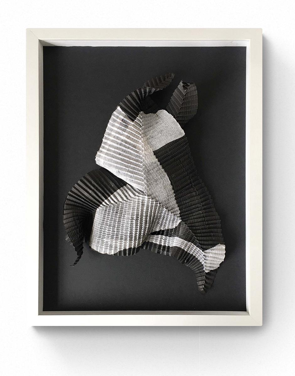 origami folded paper artwork in white frame