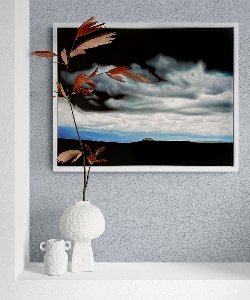 realism painting of a stormy sky with sliver of landscape