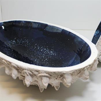 African sand cast ceramic in white with blue glaze
