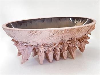 sculptural sand cast ceramic in pink with gold glaze