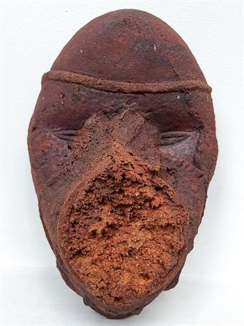 tribal mask made of terracotta clay