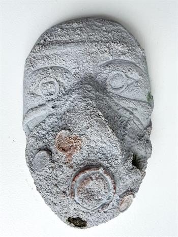Grey coloured African tribal mask in clay