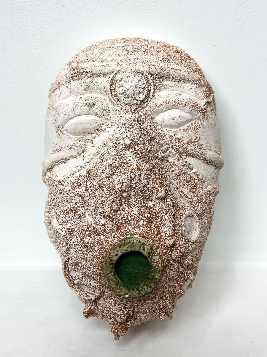 small white ceramic tribal mask