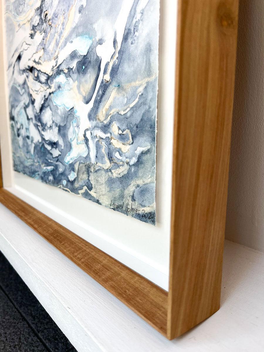 Framed abstract watercolour artwork on paper in shades of blue and yellow