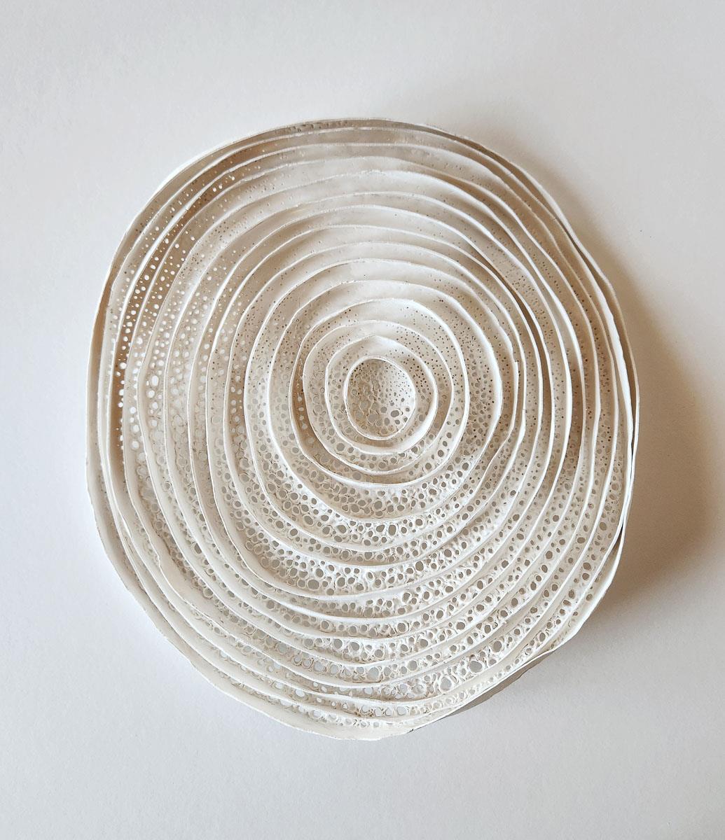 framed circular clay artwork inspired by tree rings