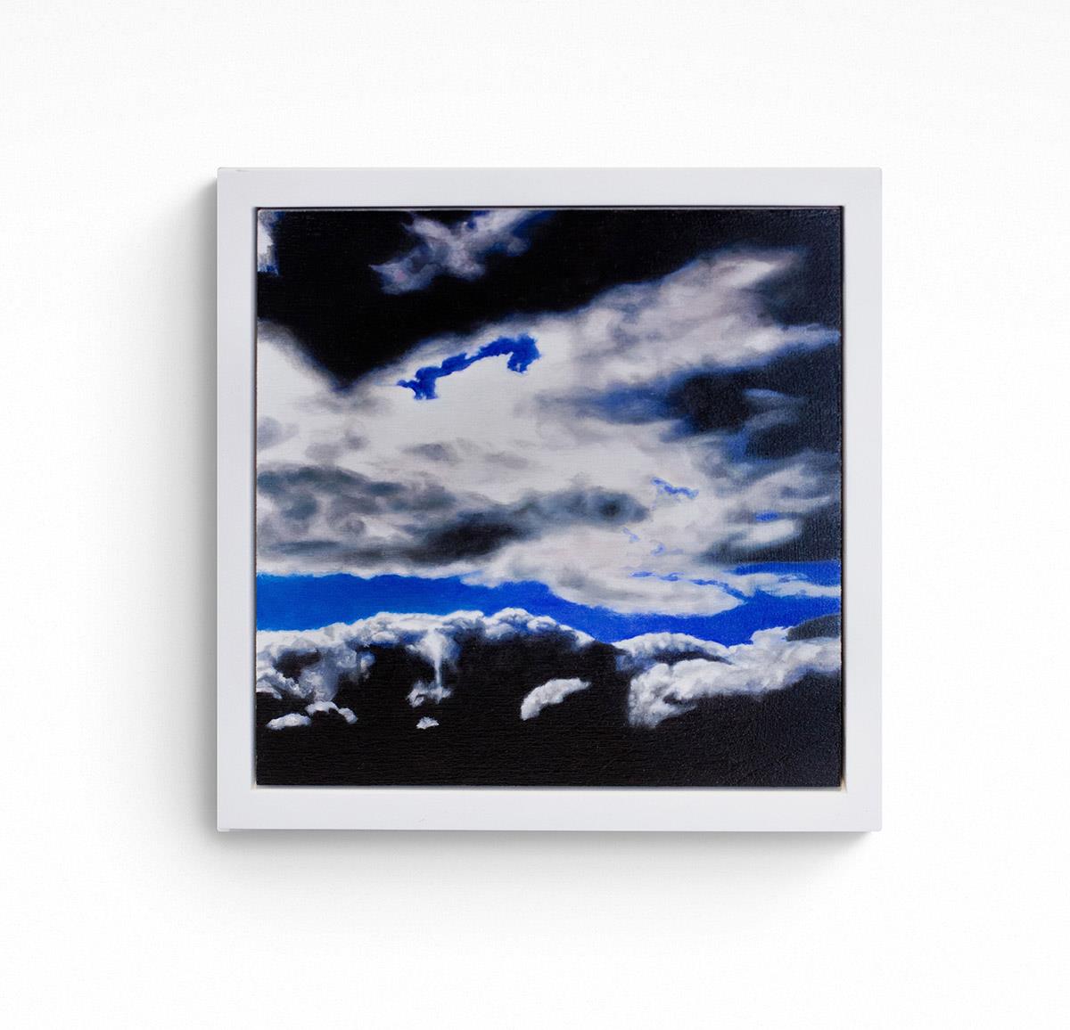 small framed oil painting of a bright blue sky with stormy clouds