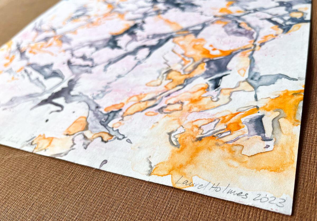 abstract monotype print on paper in shades of orange and blue