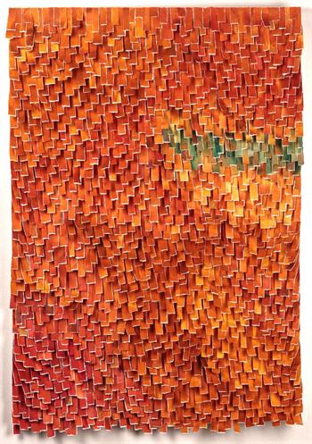 bright orange artwork with a little bit of green made from torn strips of paper