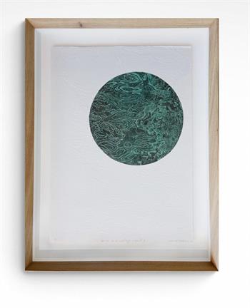 framed art print of a circle of green water