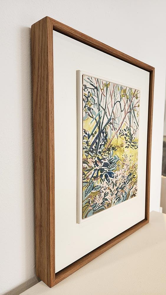 small framed painting of a woodland forest scene