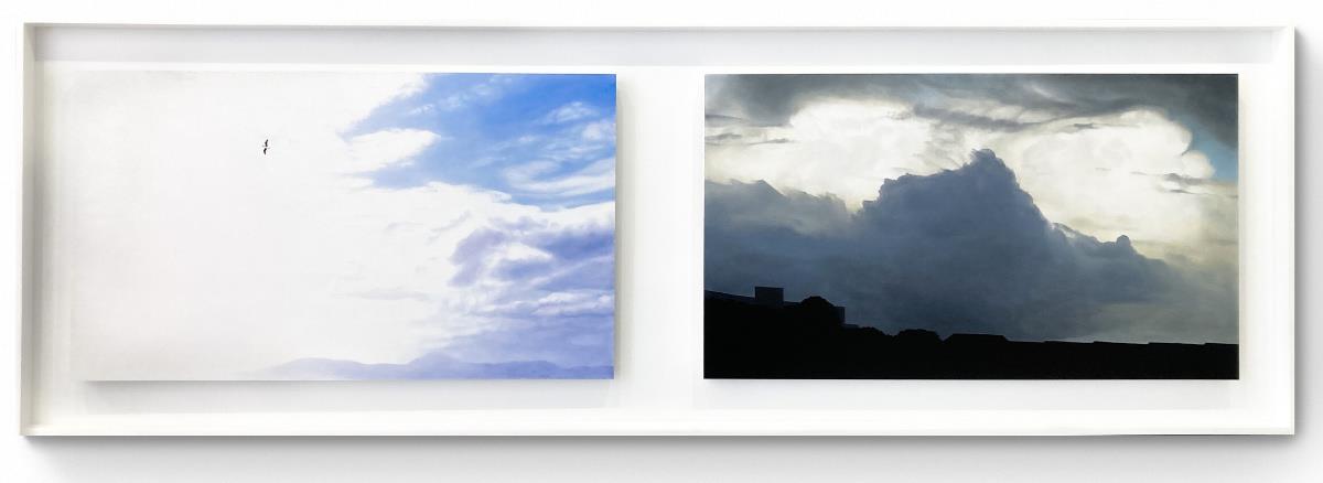 large framed oil painting of clouds and landscape in two parts