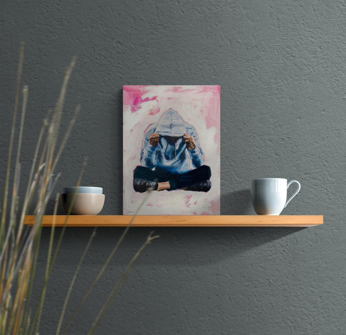 small painting of a person seated cross-legged and looking downwards