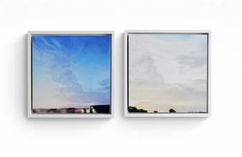 two small framed paintings of the sky at dusk and at dawn
