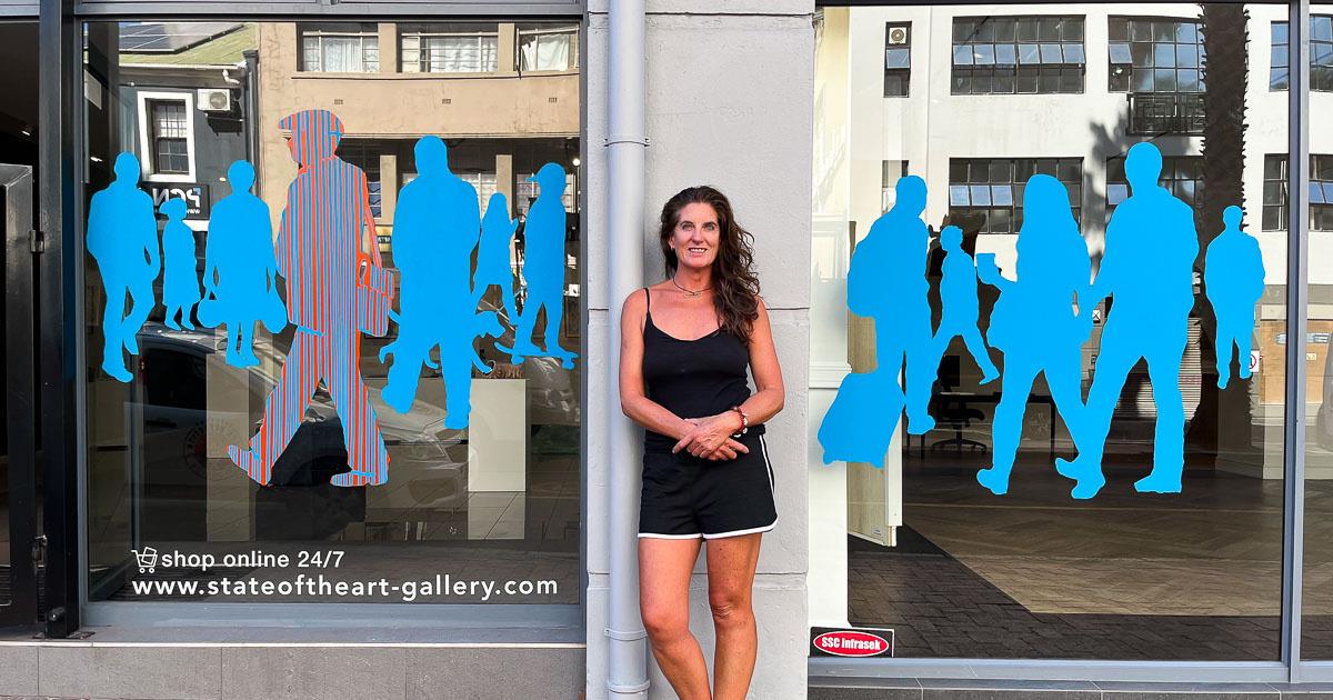 Tharien Smith and her IPAF mural on the StateoftheART Gallery windows
