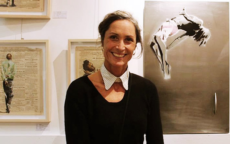 Artist Lisette Forsyth in front of her work