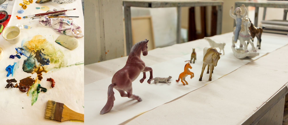 Paint and a collection of horse toys in Pascale Chandler's studio